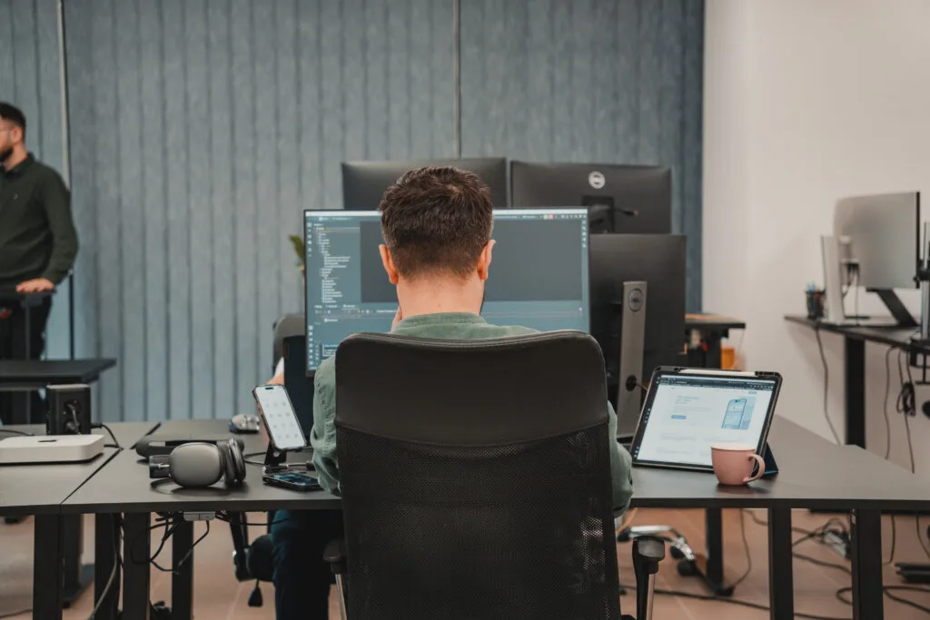 a man looking at a monitor